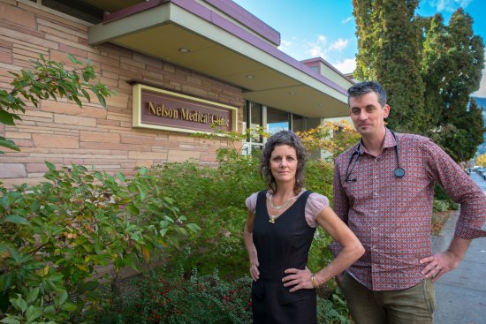 Dr MacKay and Julie standing outside of the Nelson Medical Clinic